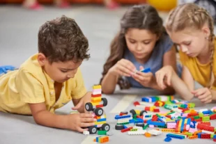 children playing together in the classroom in kindergarten 1 1